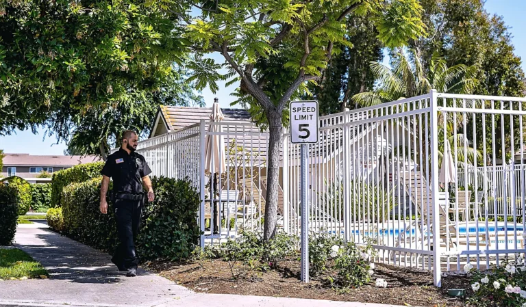 Safeguard On Demand officer on fire watch rounds along a property fence line