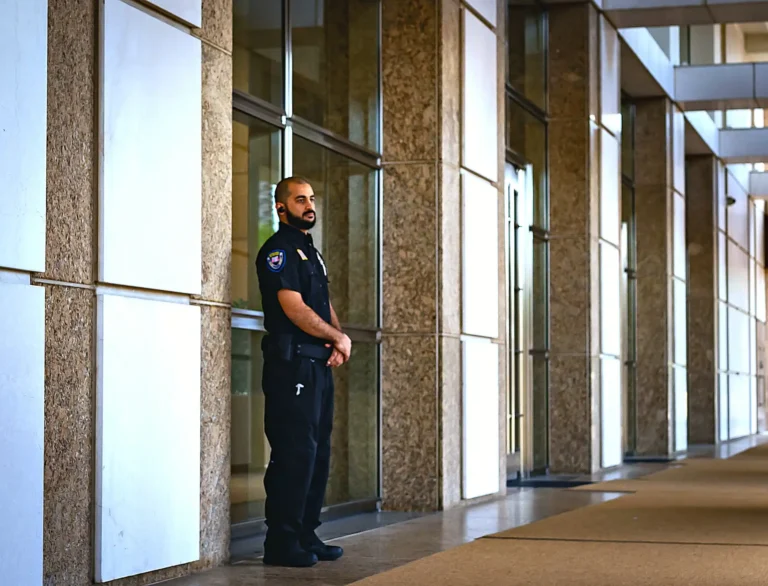Safeguard On Demand concierge security officer at a building lobby entrance