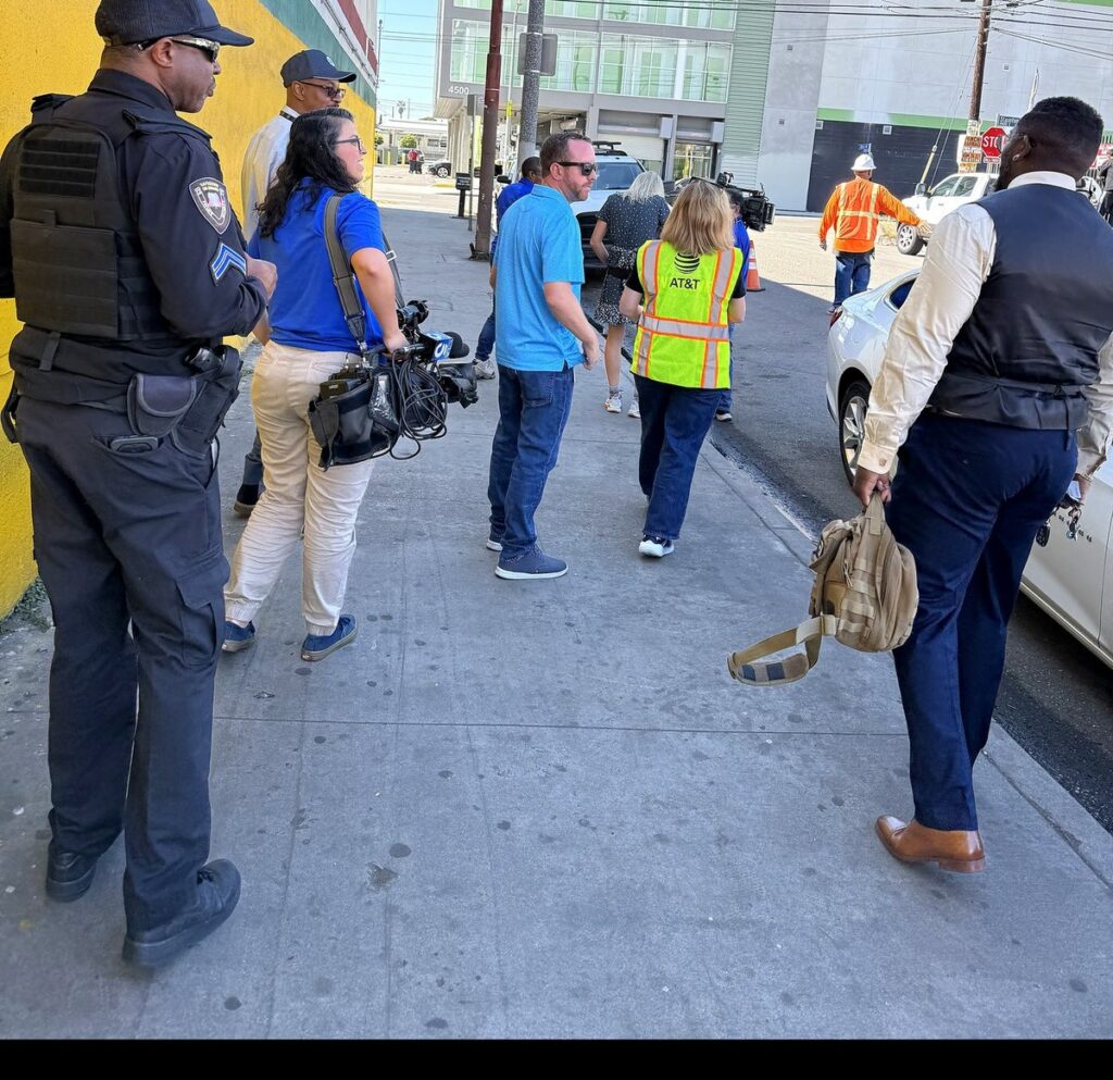Safeguard On Demand armed security officer on post in Los Angeles during a news crew visit