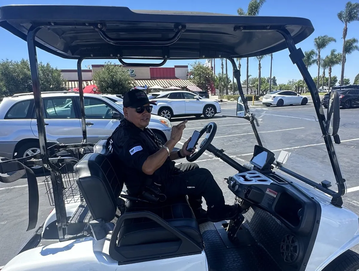 Officer on golf cart patrol covering event parking